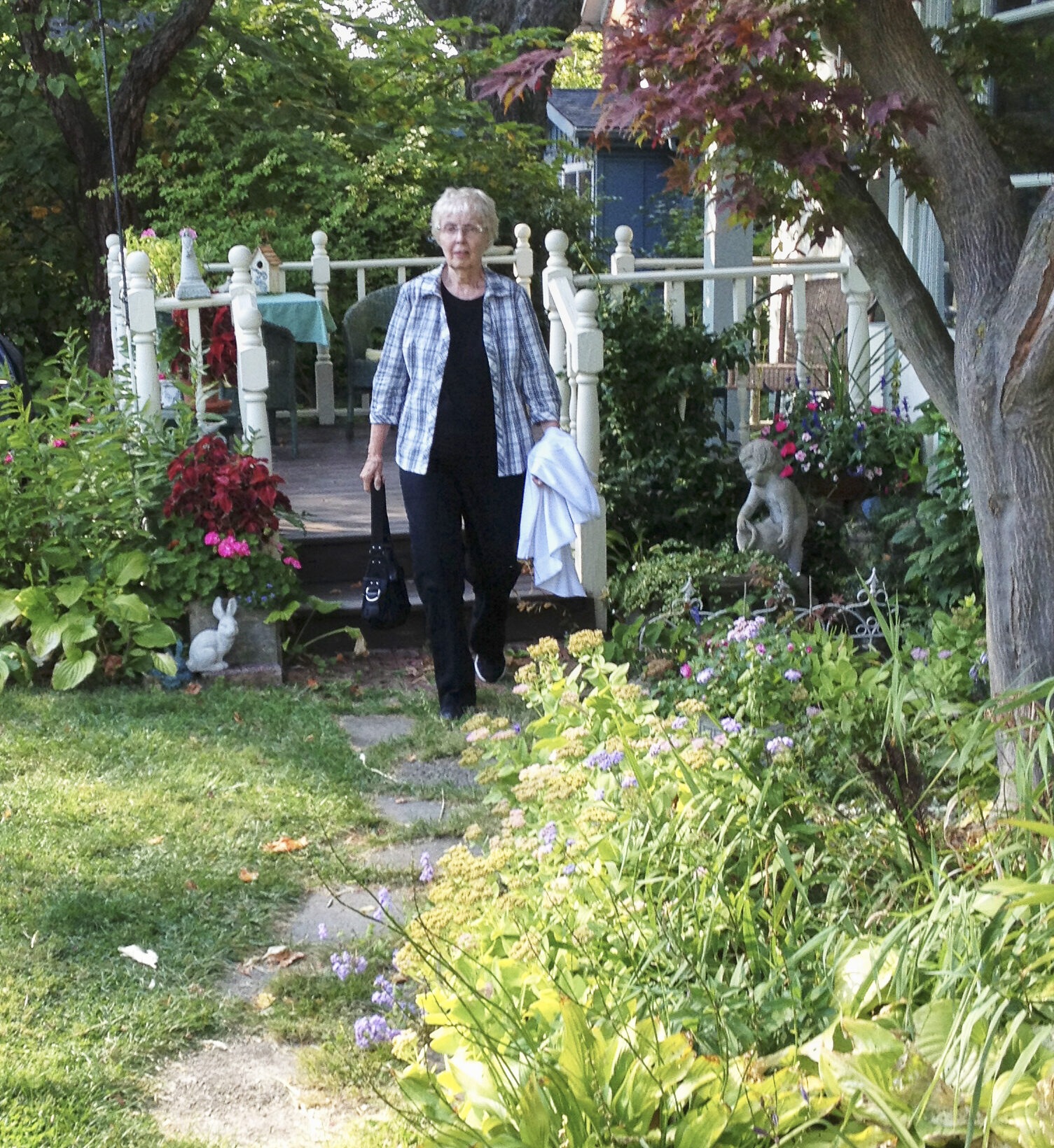 Rosemary walking in her garden